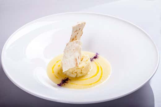 Baccalà mantecato all'olio extravergine, crema di patate e veli di pane croccante