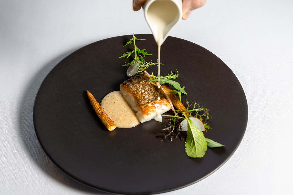 Branzino arrostito Marcello Corrado alle redini del Mindful Restaurant di Villa Eden di Merano