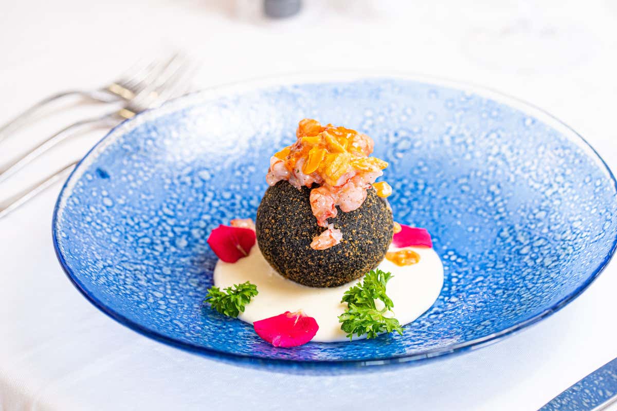 Corallo: il ristorante £$pied dans l'eau$£ che esalta il pesce locale a Marina di Modica