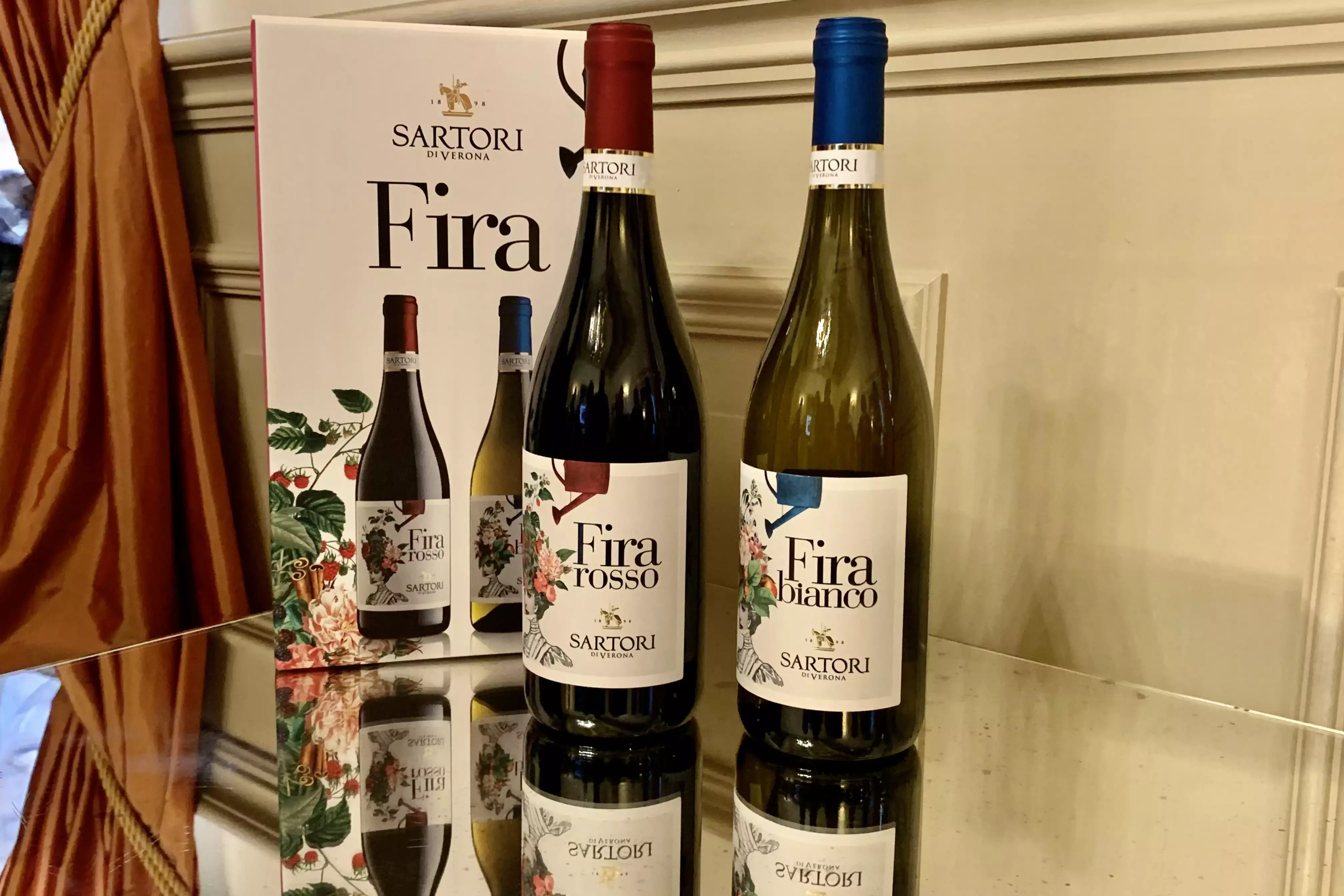 I due vini di Casa sartori con il rirtatto di Zaffira Sartori in Etichetta Fira Veronese Igt, vino dedicato alle donne