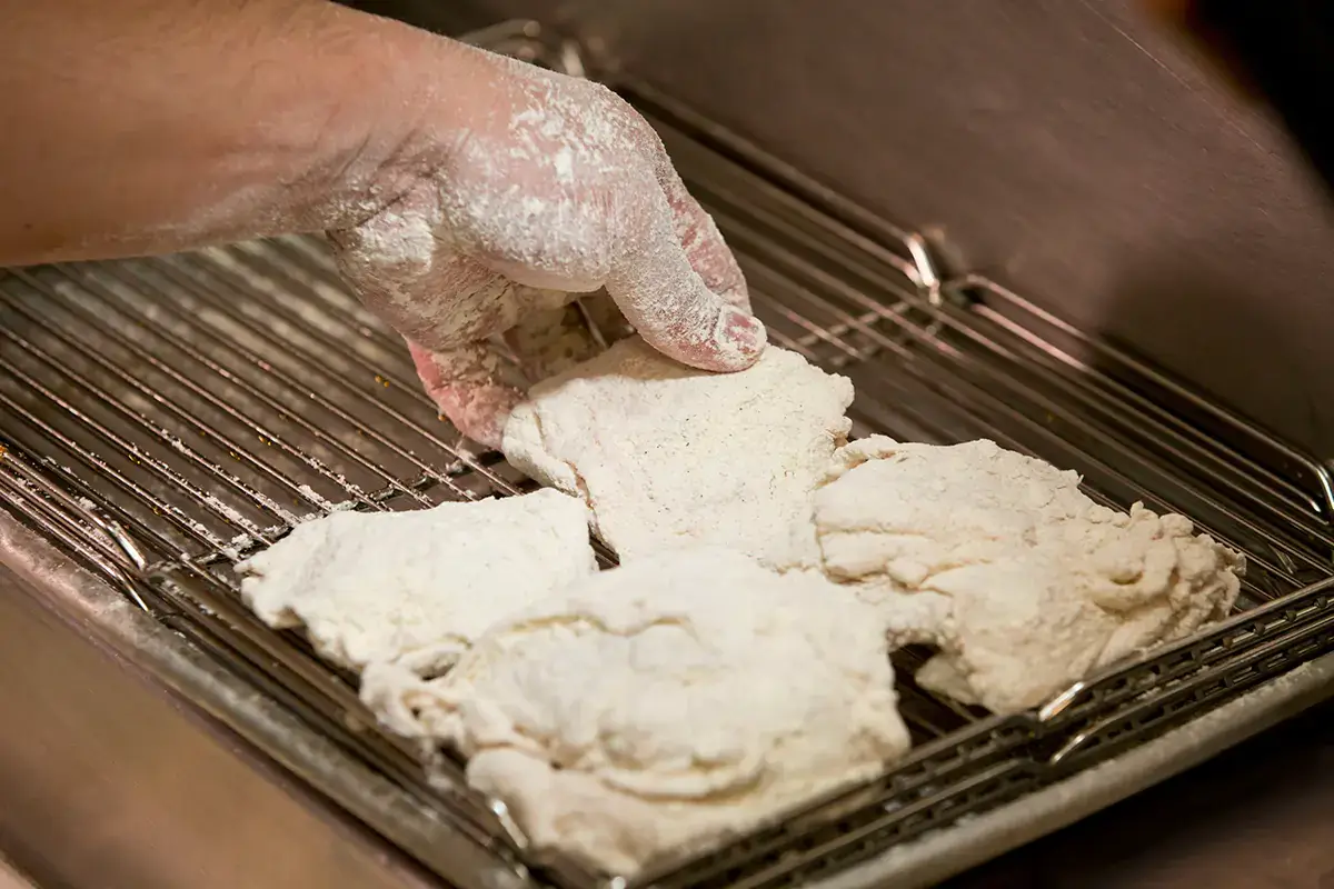Il segreto del successo? La ricetta segreta della panatura Kentucky Fried Chicken apre le porte delle proprie cucine fast food