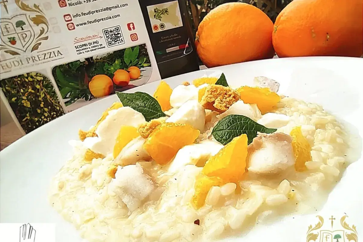 Risotto al baccalà, Arancia di Ribera, burratina e polvere di tarallo L'Arancia di Ribera Dop incontra l'arte culinaria di Enzo Contini grazie a Feudi Prezzia