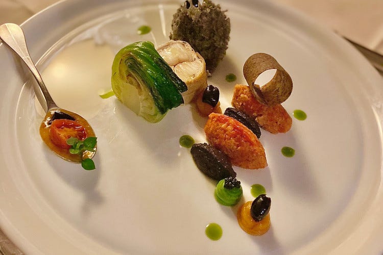 Monkfish cooked at low temperature, Taggiasca olives in different variations and candied tomatoes The magic of the past at the San Michele restaurant in Fagagna