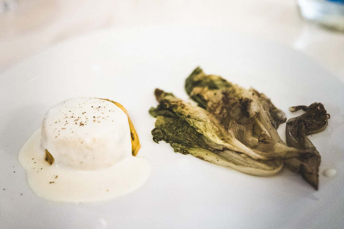 Scarola brasata dei colli di Bergamo, flan di zucca e castagne, fonduta di Formai de Mut blu d’alpeggio La Trattoria Visconti di Ambivere inaugura la nuova cantina